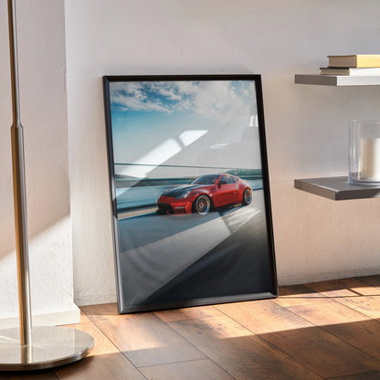 Nissan 370Z red sports car poster in black frame leaning on wall, modern automotive wall art.