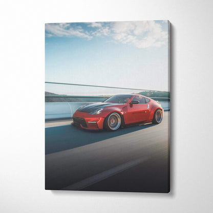 Red Nissan 370z on road with blue sky canvas art wall decor vertical print.
