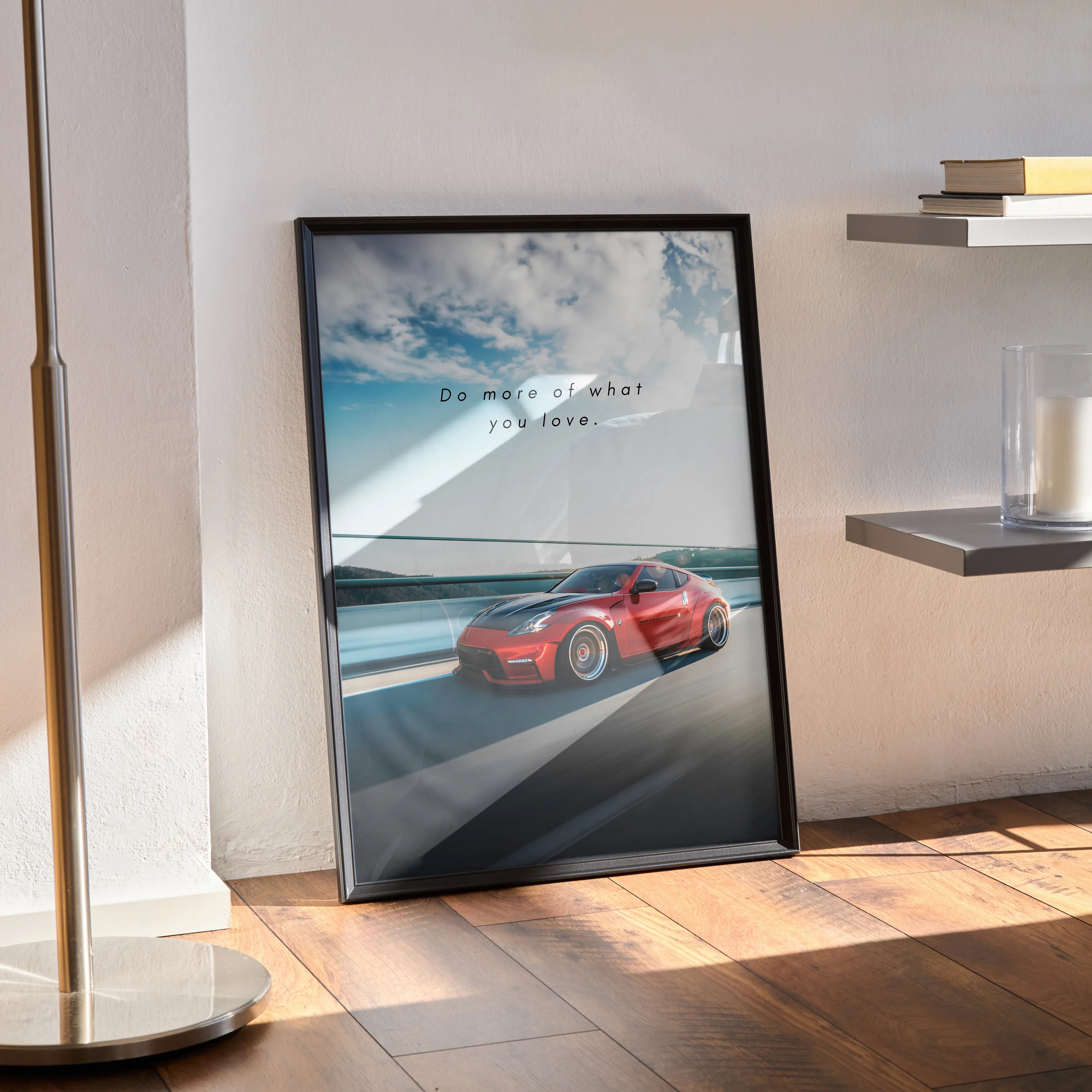 Nissan 370z poster wall art with red sports car and motivational text in black frame.