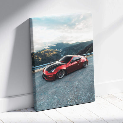 Red Nissan 370z sports car on mountain road printed on vertical canvas wall art with glossy finish.
