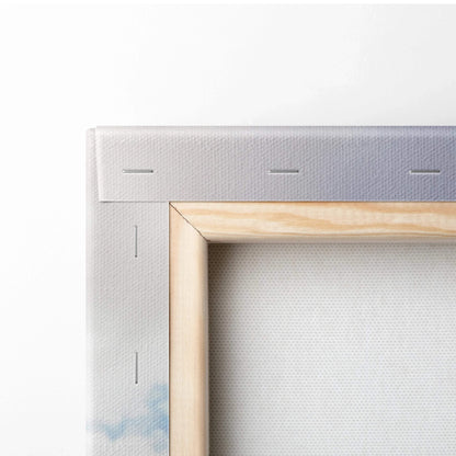 Close-up of stretched canvas wall art with wooden frame and stapled edges.