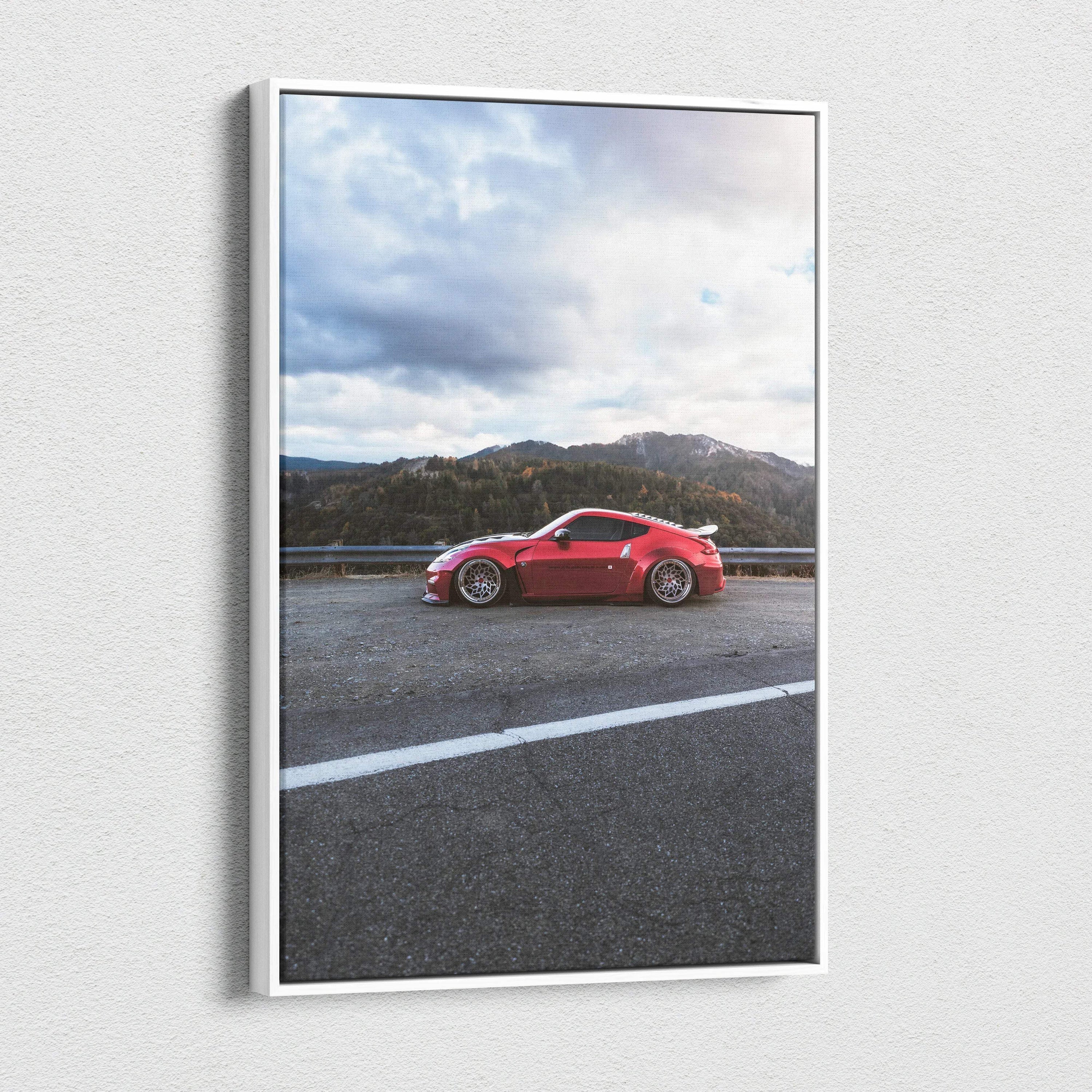 Vertical canvas wall art featuring a red Nissan 370z sports car with mountain background.