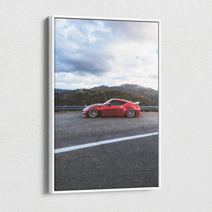 Vertical canvas wall art featuring a red Nissan 370z sports car with mountain background.