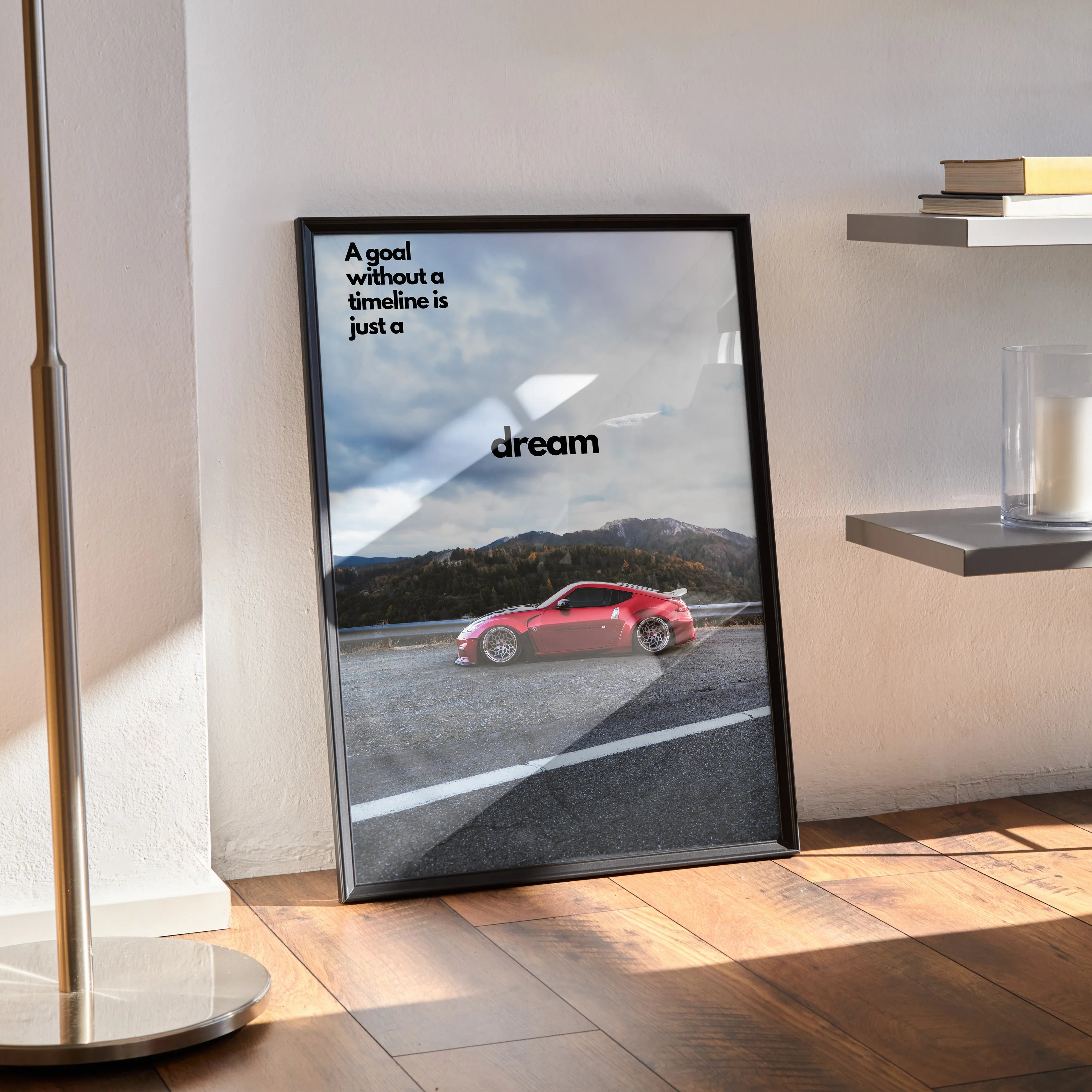 Motivational poster wall art featuring a red Nissan 370z on an open road under a cloudy sky with inspiring text.