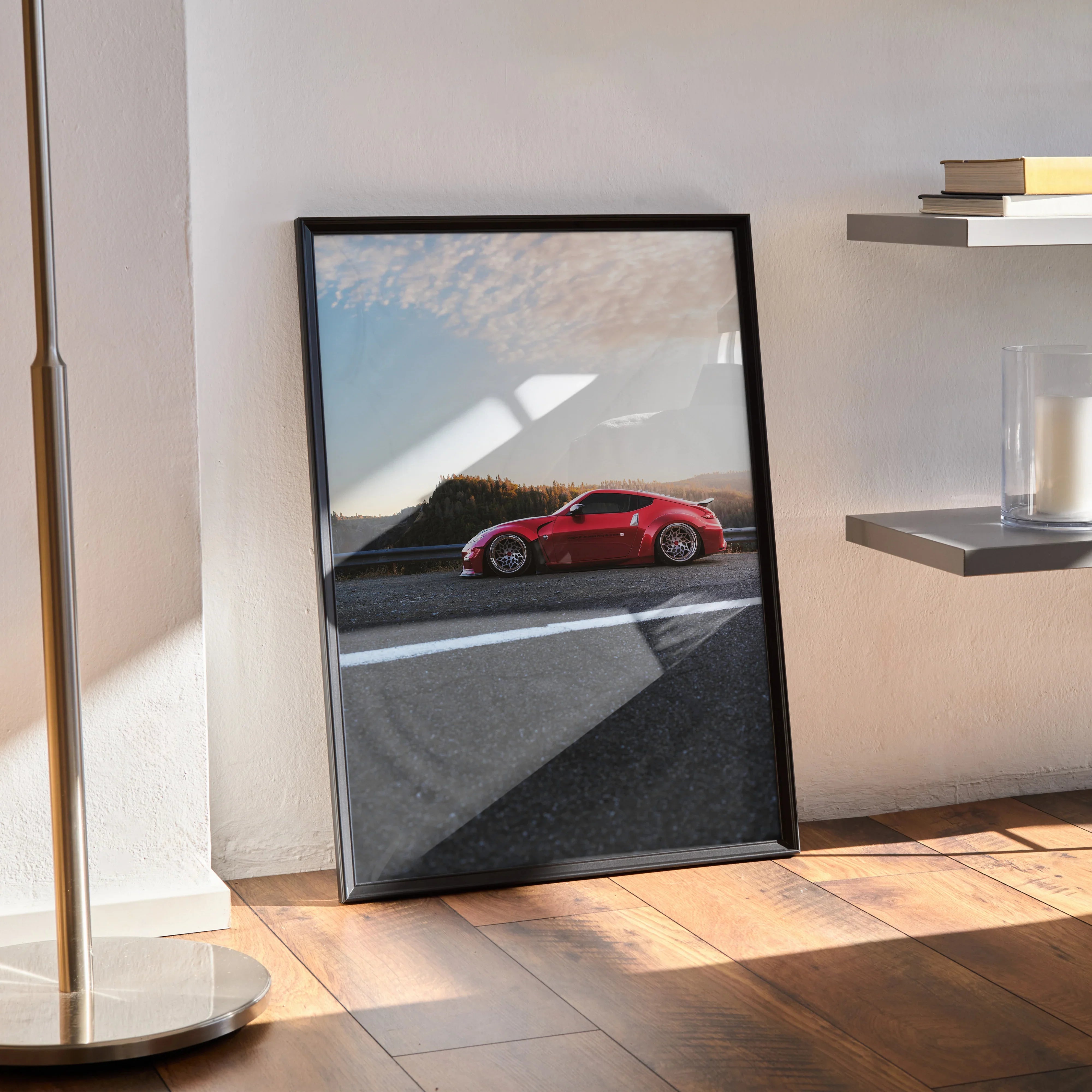 Nissan 370Z red sports car poster leaning against wall with sunlight and shadow, luxury wall art.