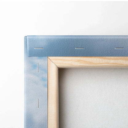 Close-up of wooden frame corner and blue wrapped canvas for vertical wall art canvas print.