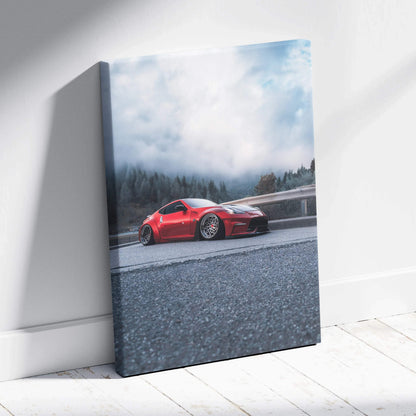 Red Nissan 370z car on road against cloudy sky canvas wall art vertical print.