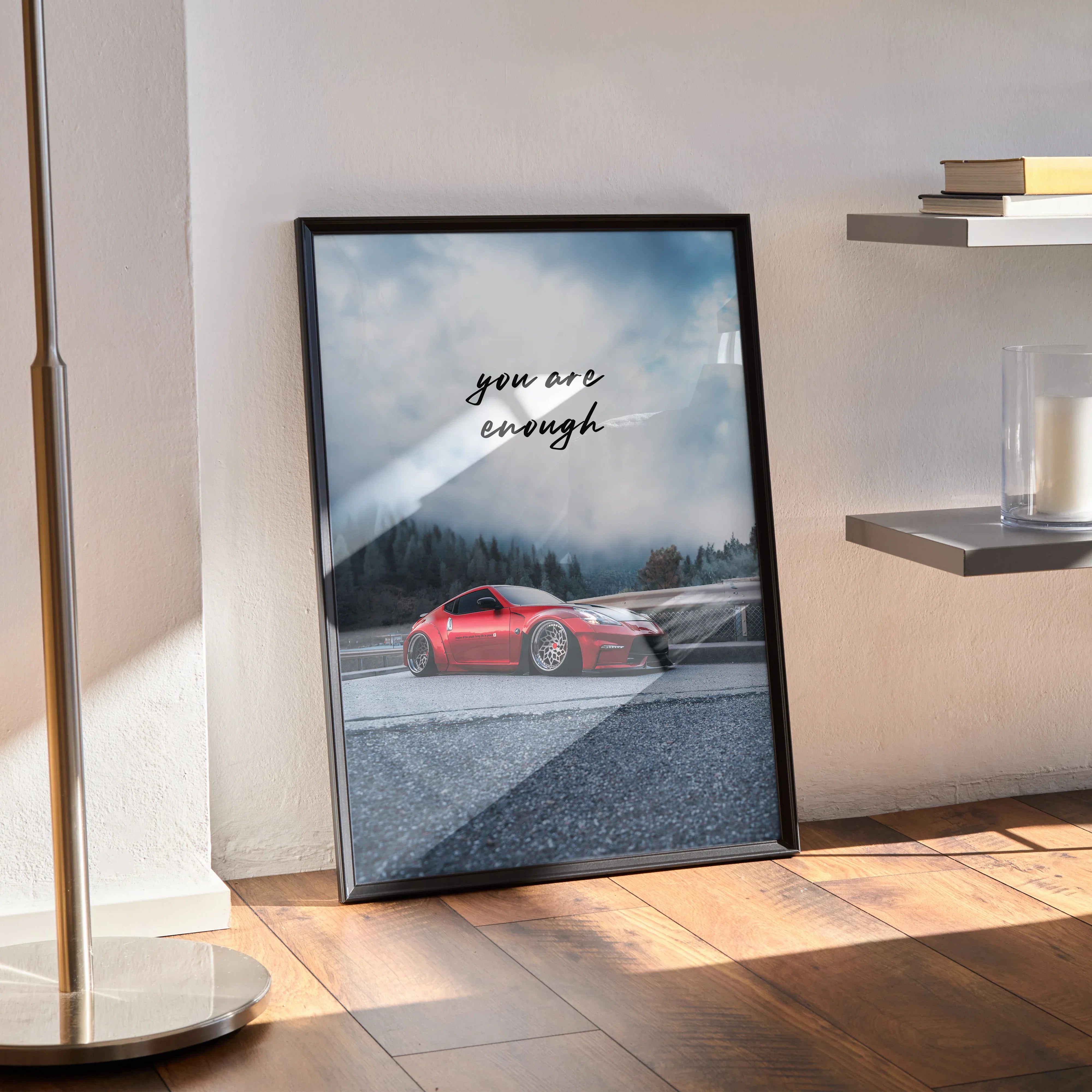 Framed motivational poster wall art featuring a red Nissan 370z with "You are enough" text against a misty mountain.
