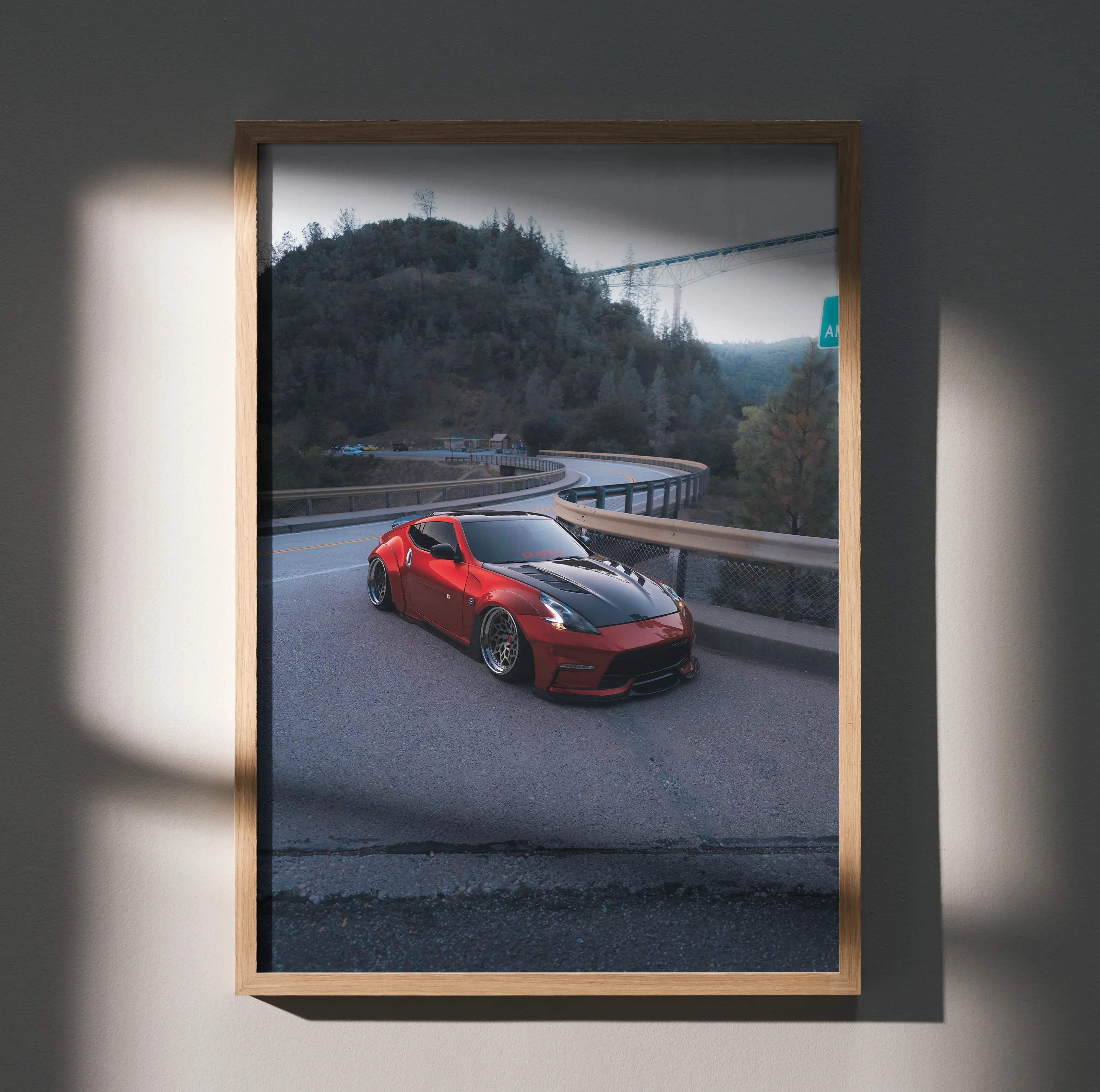 Red and black nissan 370z sports car art print in a light wood frame high resolution premium automotive decor