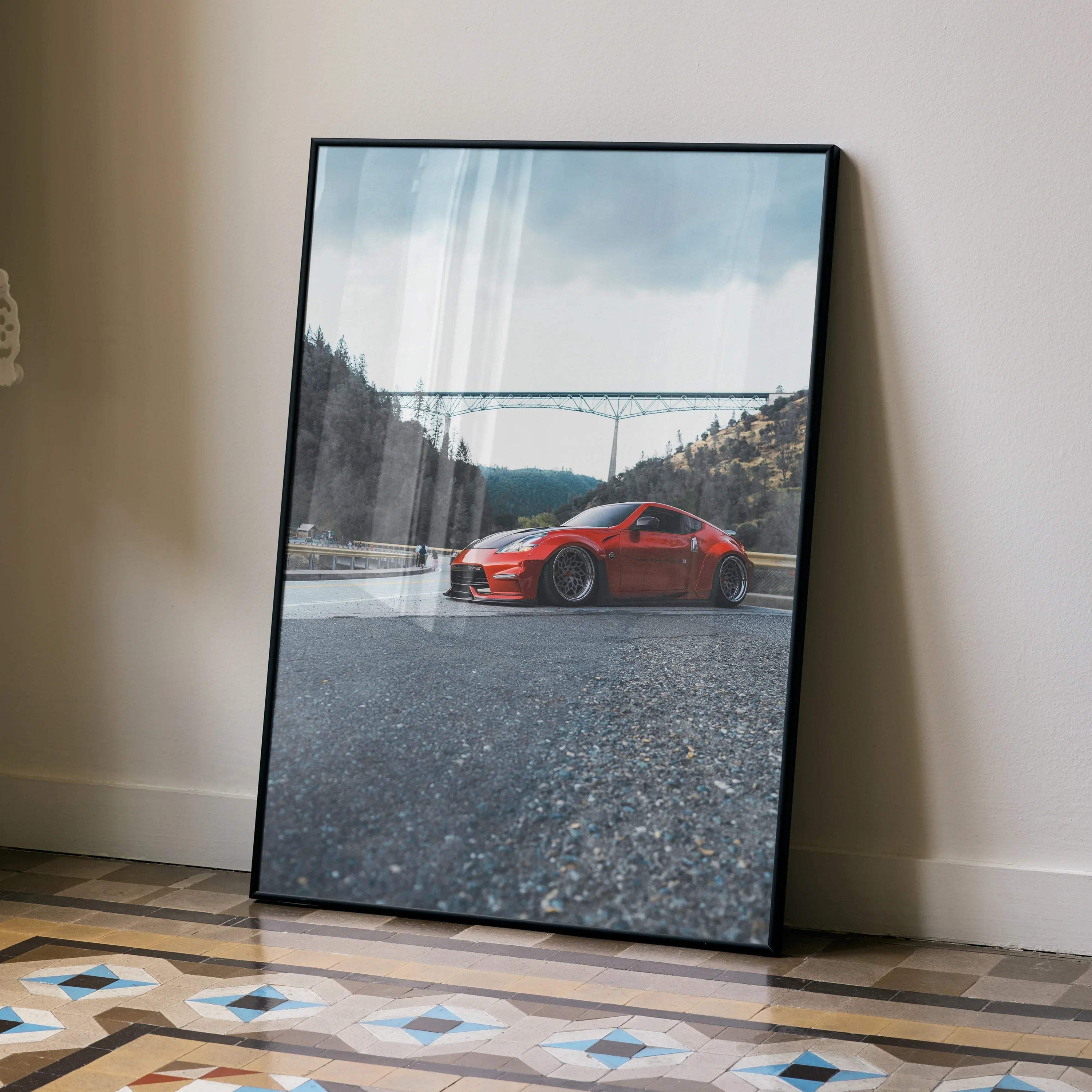 Nissan 370Z red sports car poster with mountain and bridge background, framed wall art.