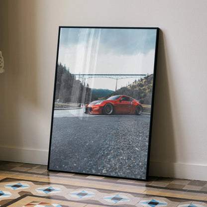 Nissan 370Z red sports car poster with mountain and bridge background, framed wall art.