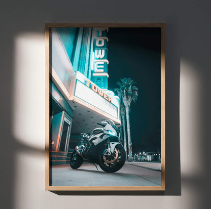 BMW S1000RR motorcycle poster with neon tower sign and palm tree at night wall art.