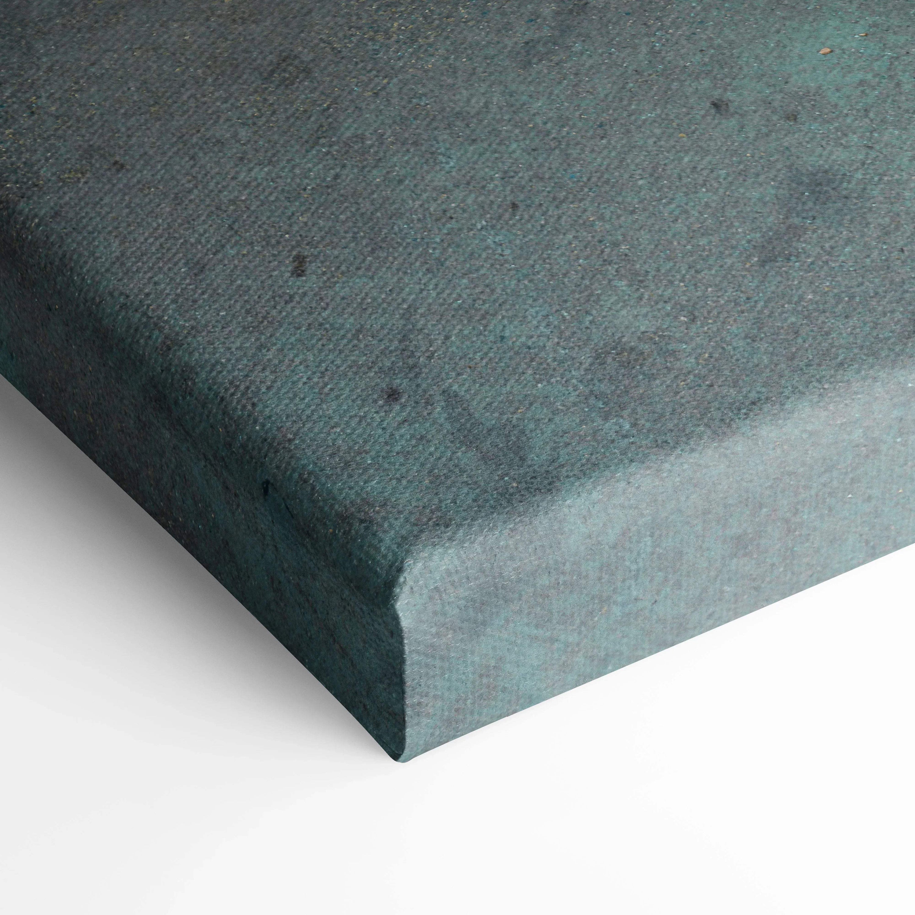 Corner close-up of textured teal canvas wall art stretched over wooden frame.