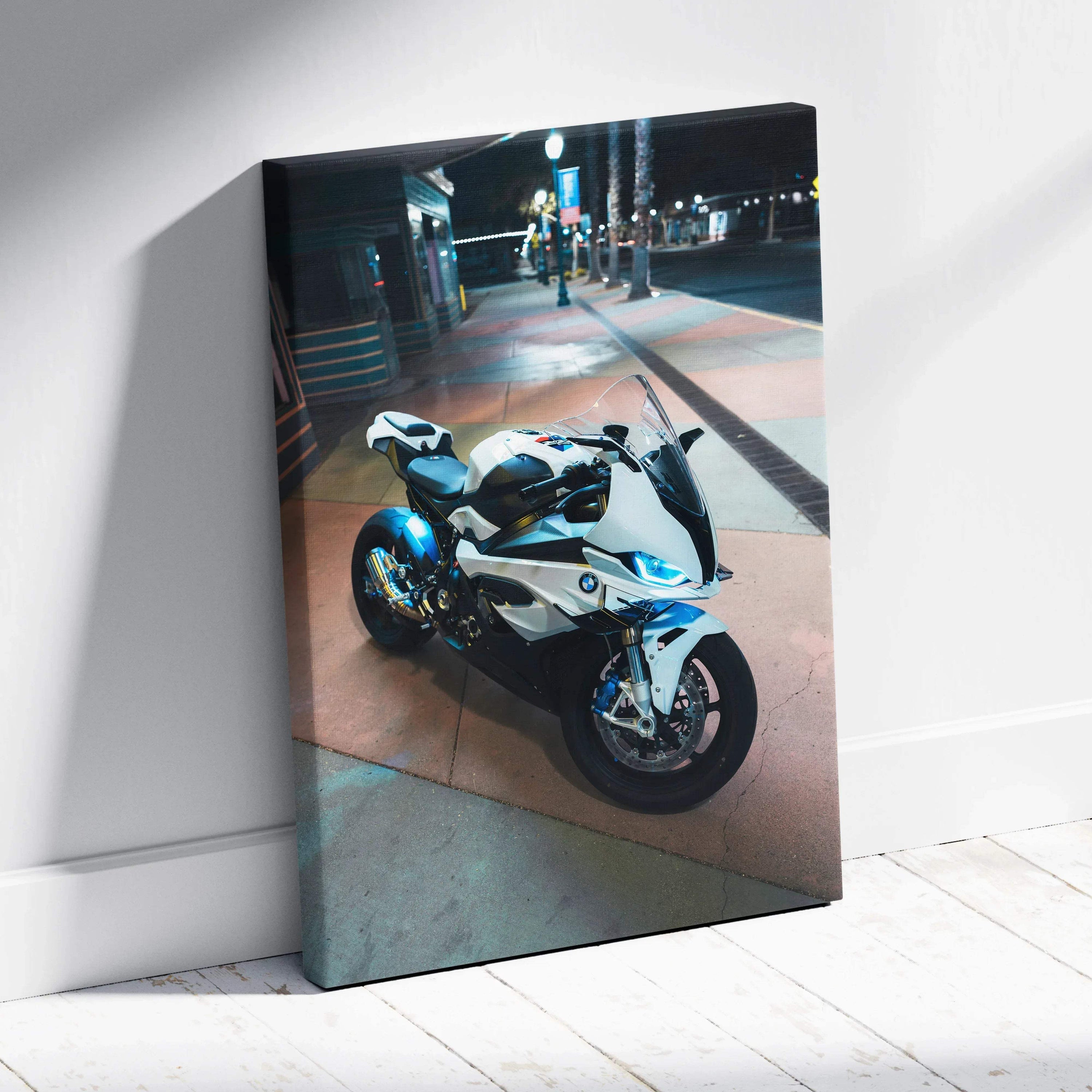 BMW S1000RR motorcycle illuminated at night on urban street canvas wall art.
