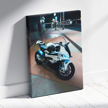 BMW S1000RR motorcycle illuminated at night on urban street canvas wall art.