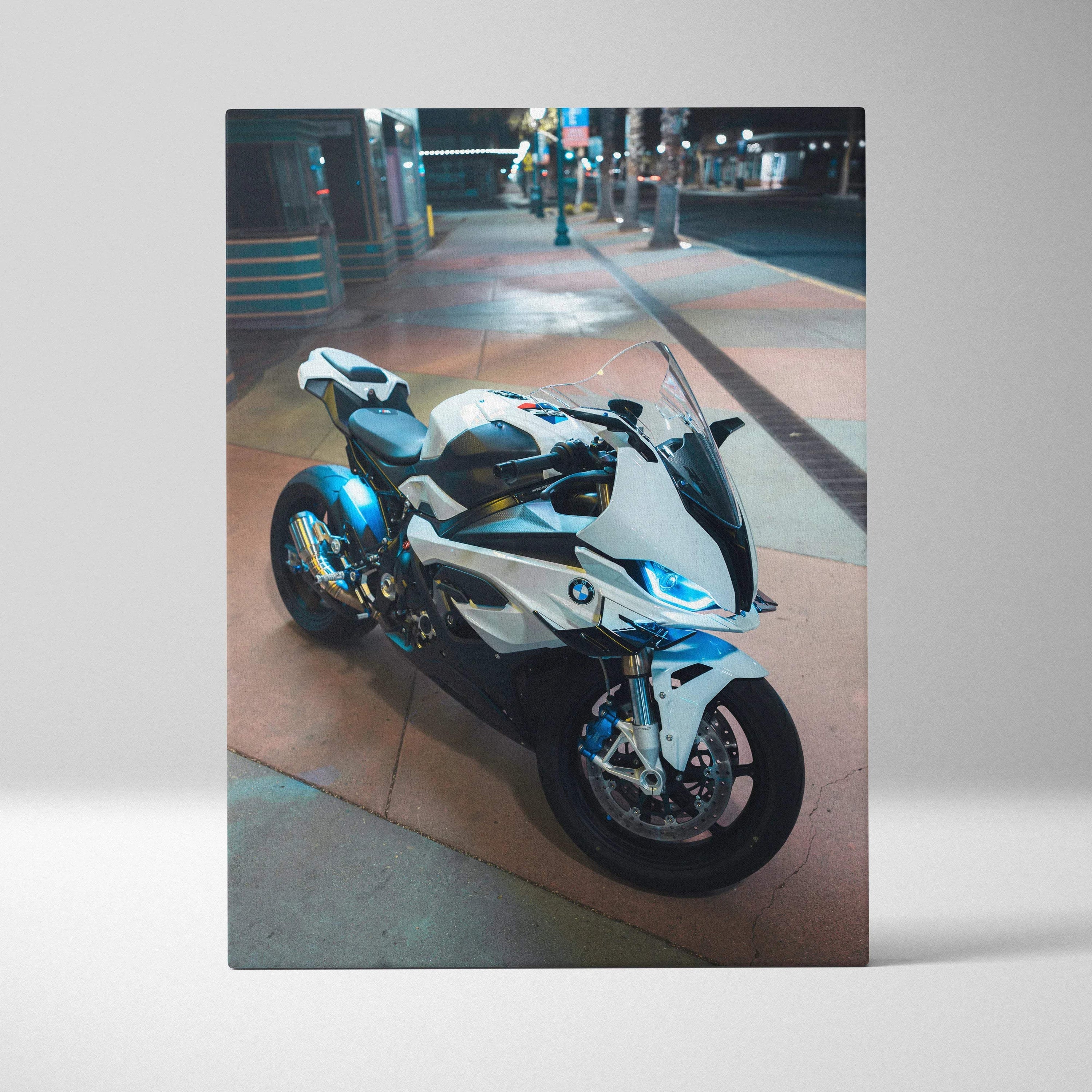 BMW S1000RR motorcycle art canvas print showcasing sleek white and blue bike at night street scene wall art.