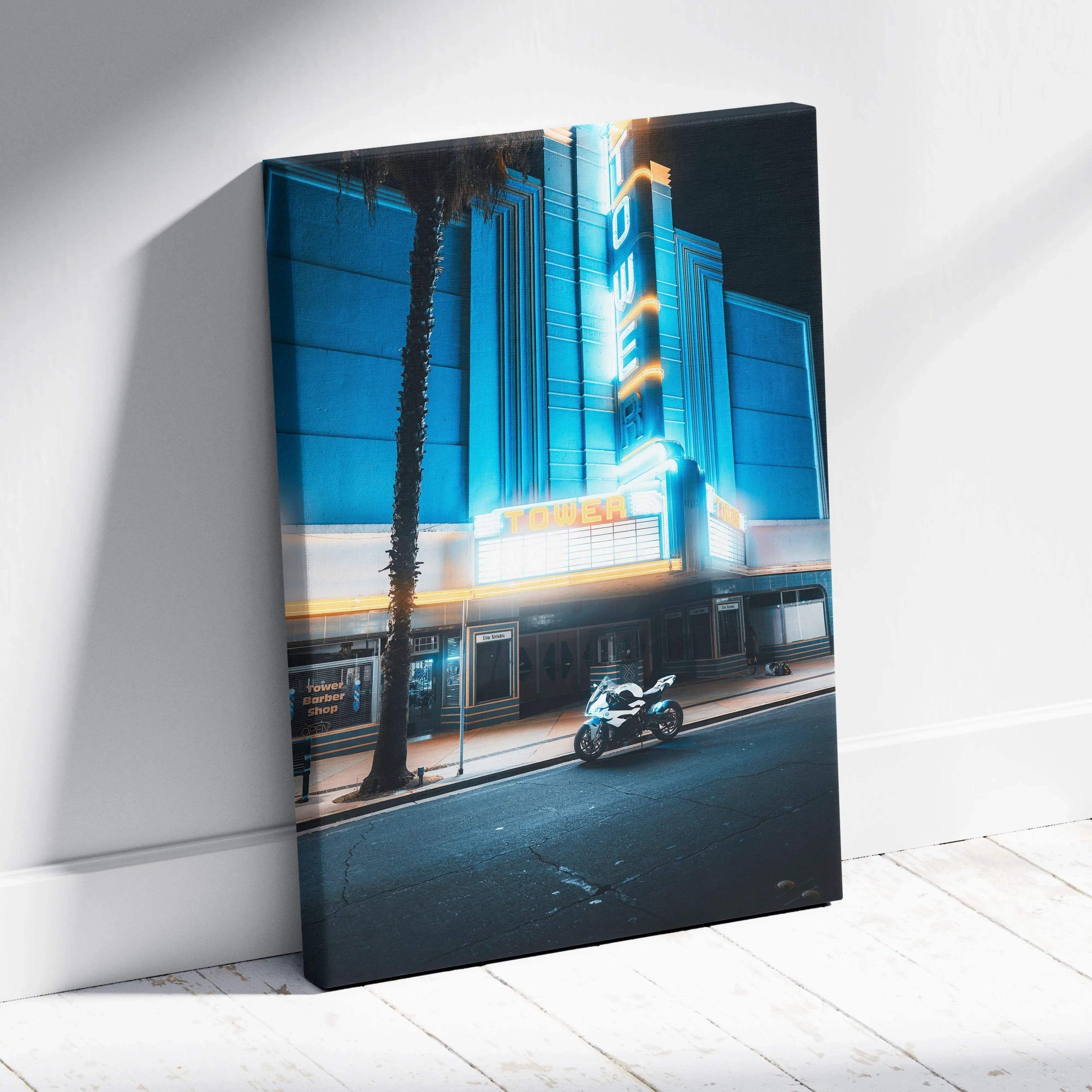 BMW S1000RR motorcycle in front of neon-lit building at night canvas wall art.