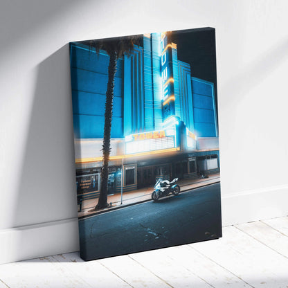 BMW S1000RR motorcycle in front of neon-lit building at night canvas wall art.