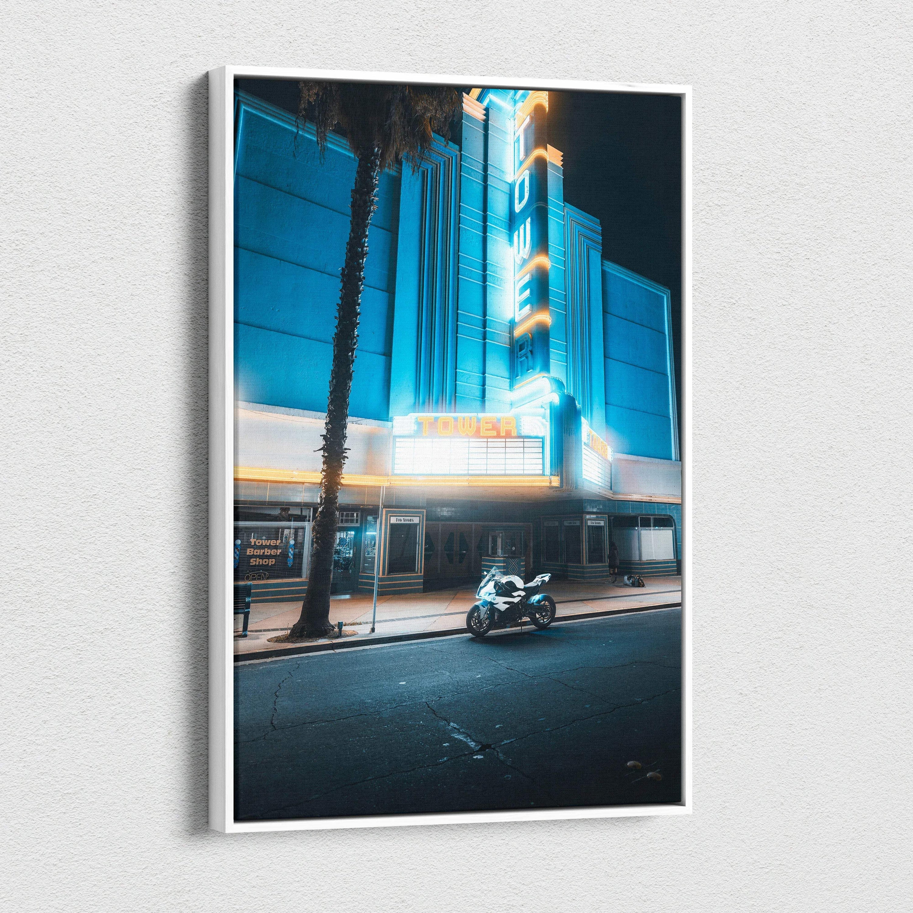 Vertical canvas wall art featuring a neon-lit urban scene with a parked BMW S1000RR motorcycle at night.