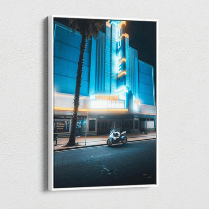 Vertical canvas wall art featuring a neon-lit urban scene with a parked BMW S1000RR motorcycle at night.