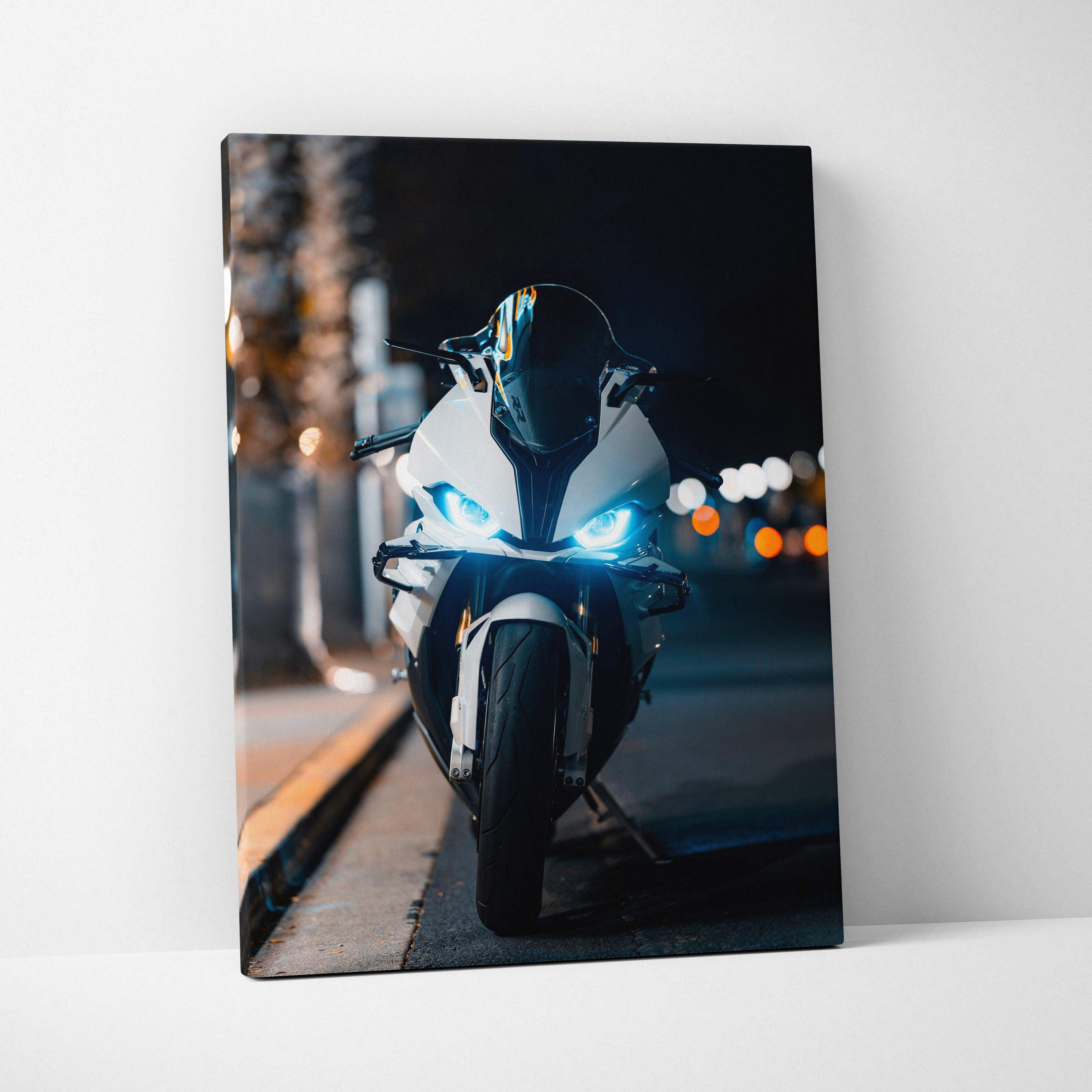 BMW S1000RR motorcycle at night with bright headlights on vertical canvas wall art.