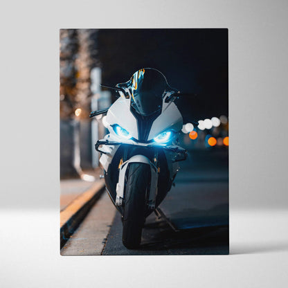 BMW S1000RR sportbike front view with illuminated headlights on vertical canvas wall art.