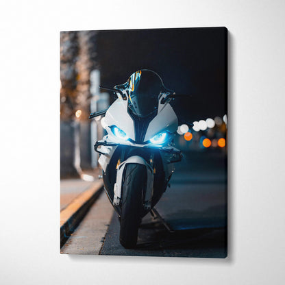 BMW S1000RR motorcycle canvas art with glowing headlights on urban street at night wall art.