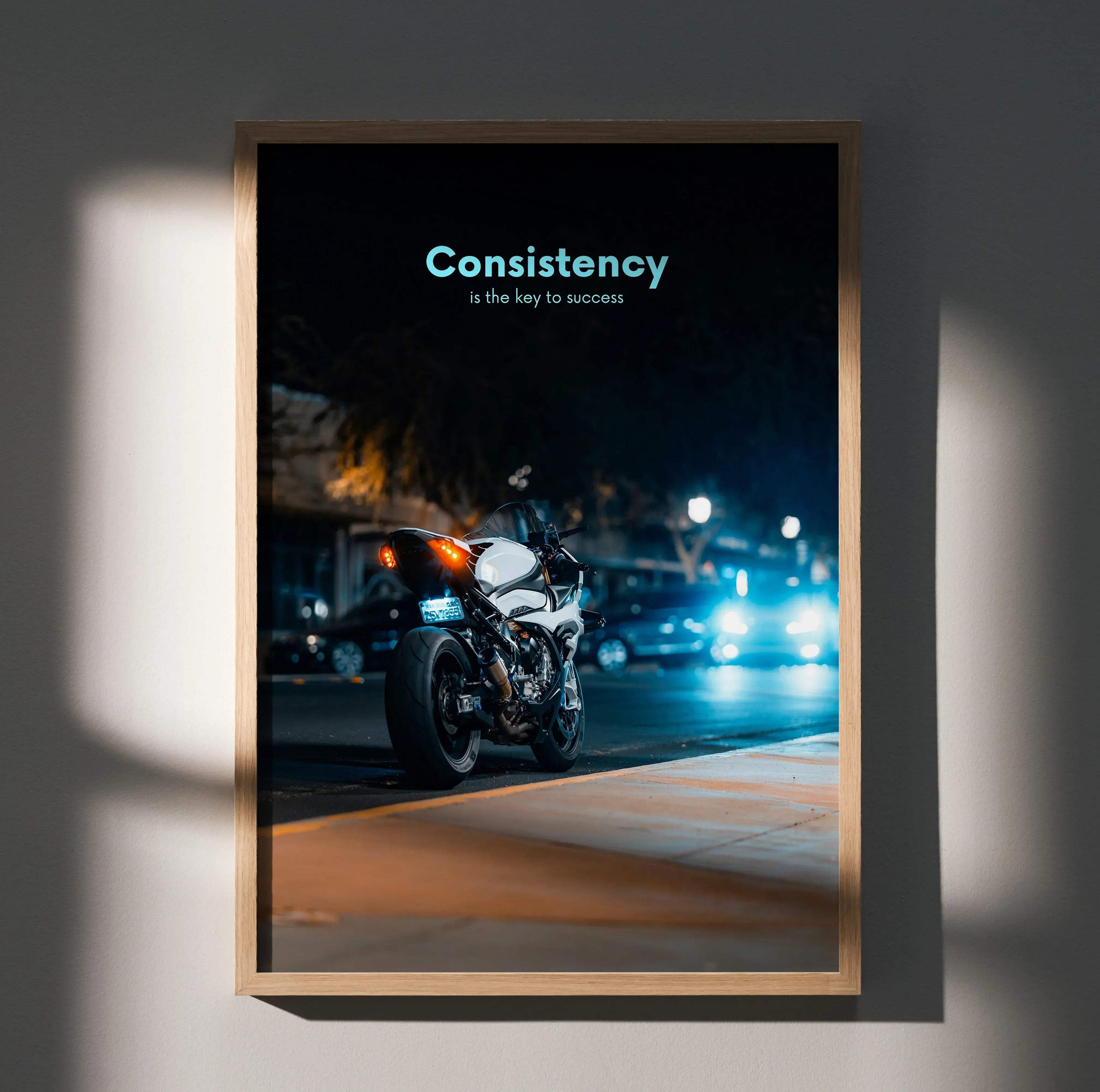 Motivational poster wall art featuring a BMW S1000RR motorcycle at night with "Consistency is the key to success" text.