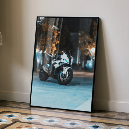 Framed poster wall art featuring BMW S1000RR motorcycle parked in urban nighttime setting.