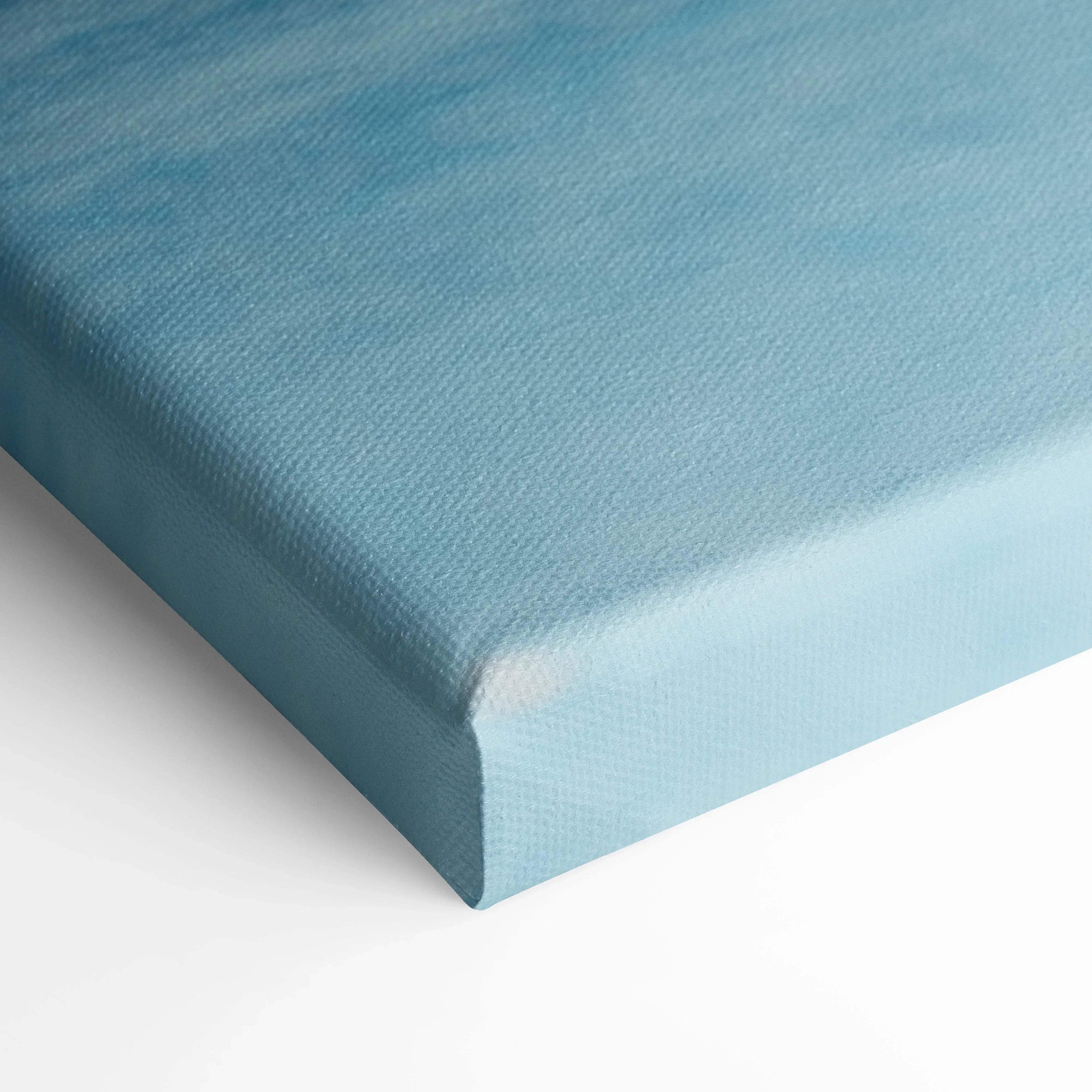 Close-up of blue textured canvas wall art corner with museum-quality finish.