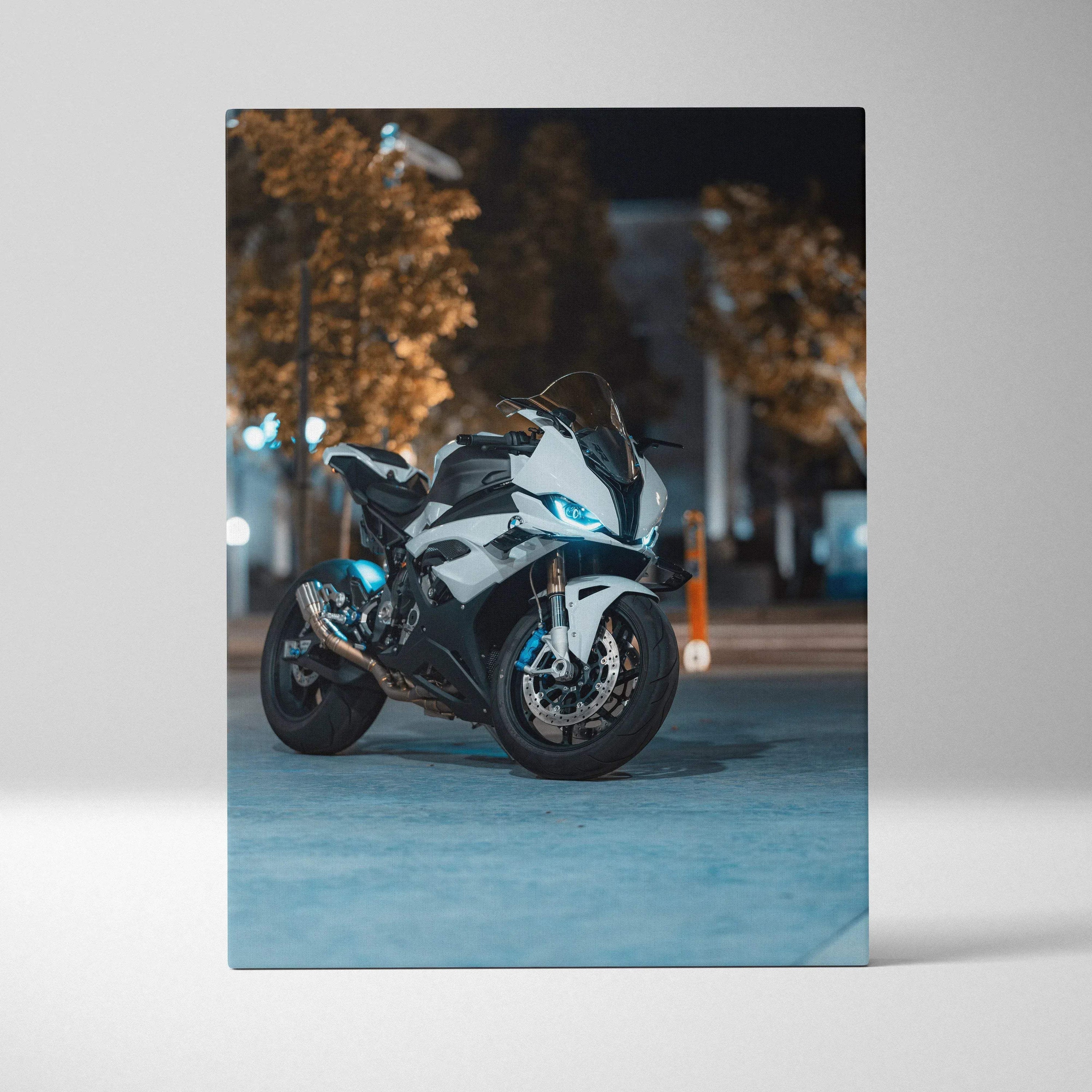 BMW S1000RR motorcycle canvas wall art with blue headlights in urban night setting.