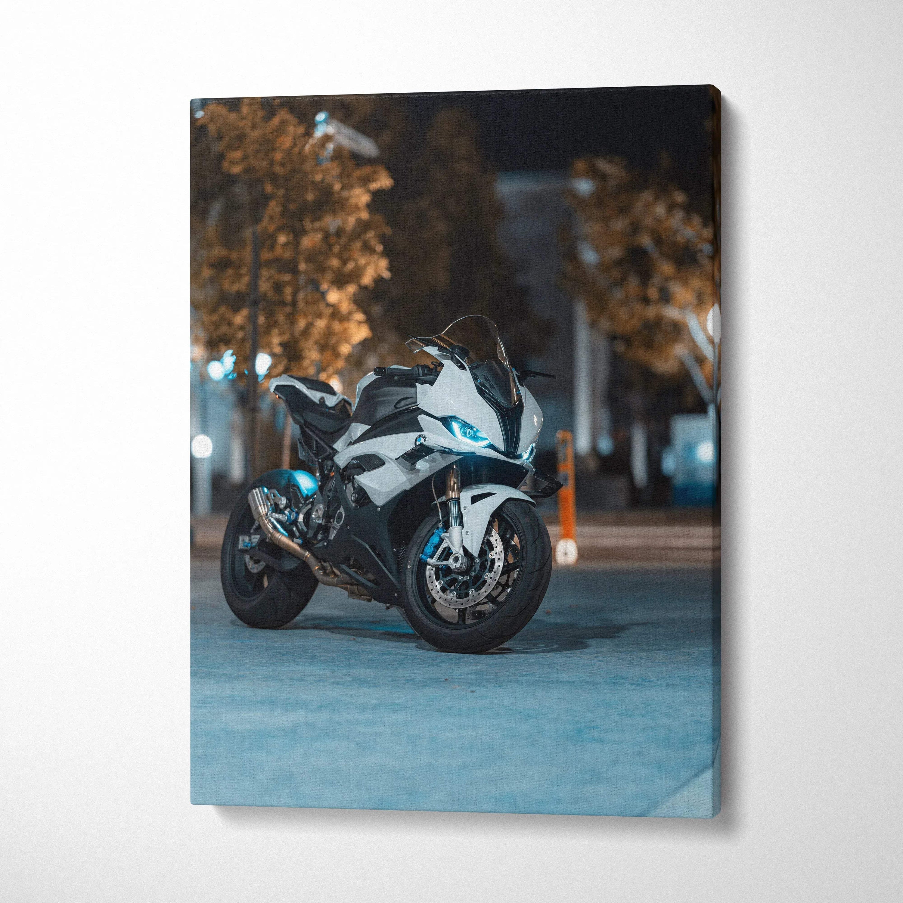 Vertical canvas art of BMW S1000RR sport motorcycle parked on city street at night.