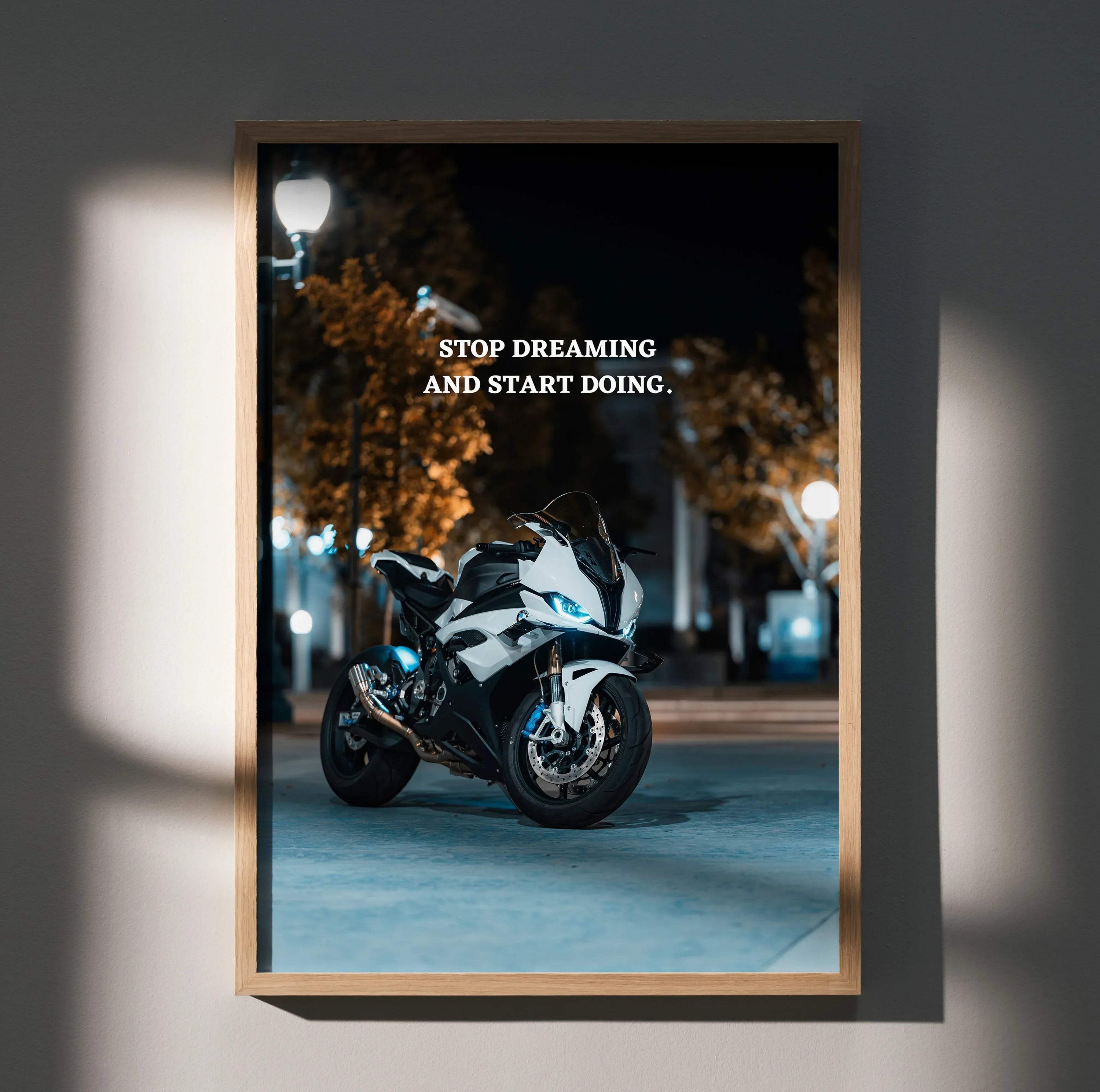 Motivational poster wall art featuring BMW S1000RR motorcycle with inspiring text "Stop Dreaming And Start Doing" at night.