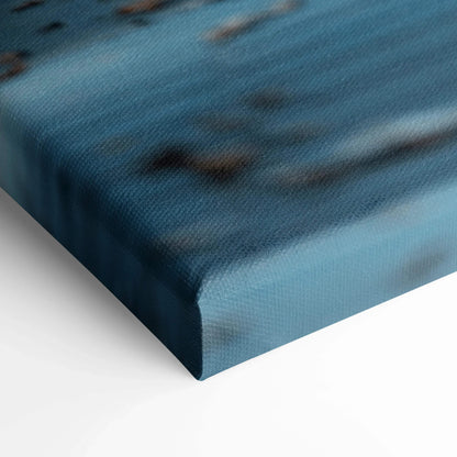 Close-up of textured canvas art with blue and black abstract design for wall art display.