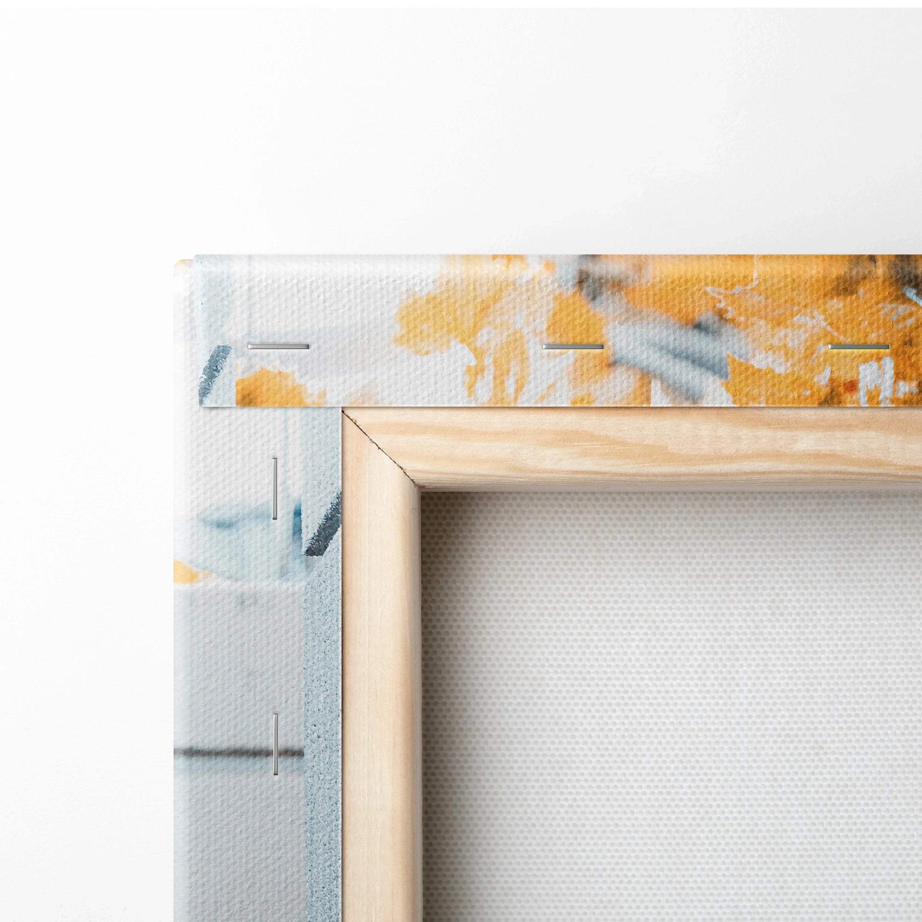 Close-up of natural wood frame corner with high-resolution textured canvas art print in yellow and blue tones for wall art.