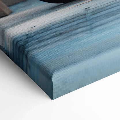 Close-up of blue and black high-resolution canvas wall art with textured fabric surface and wrapped edges.