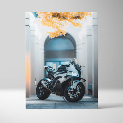 BMW S1000RR motorcycle on vertical canvas art with architectural arch and orange foliage background.