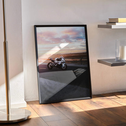 BMW S1000RR motorcycle poster with sunset background framed as wall art in modern room.