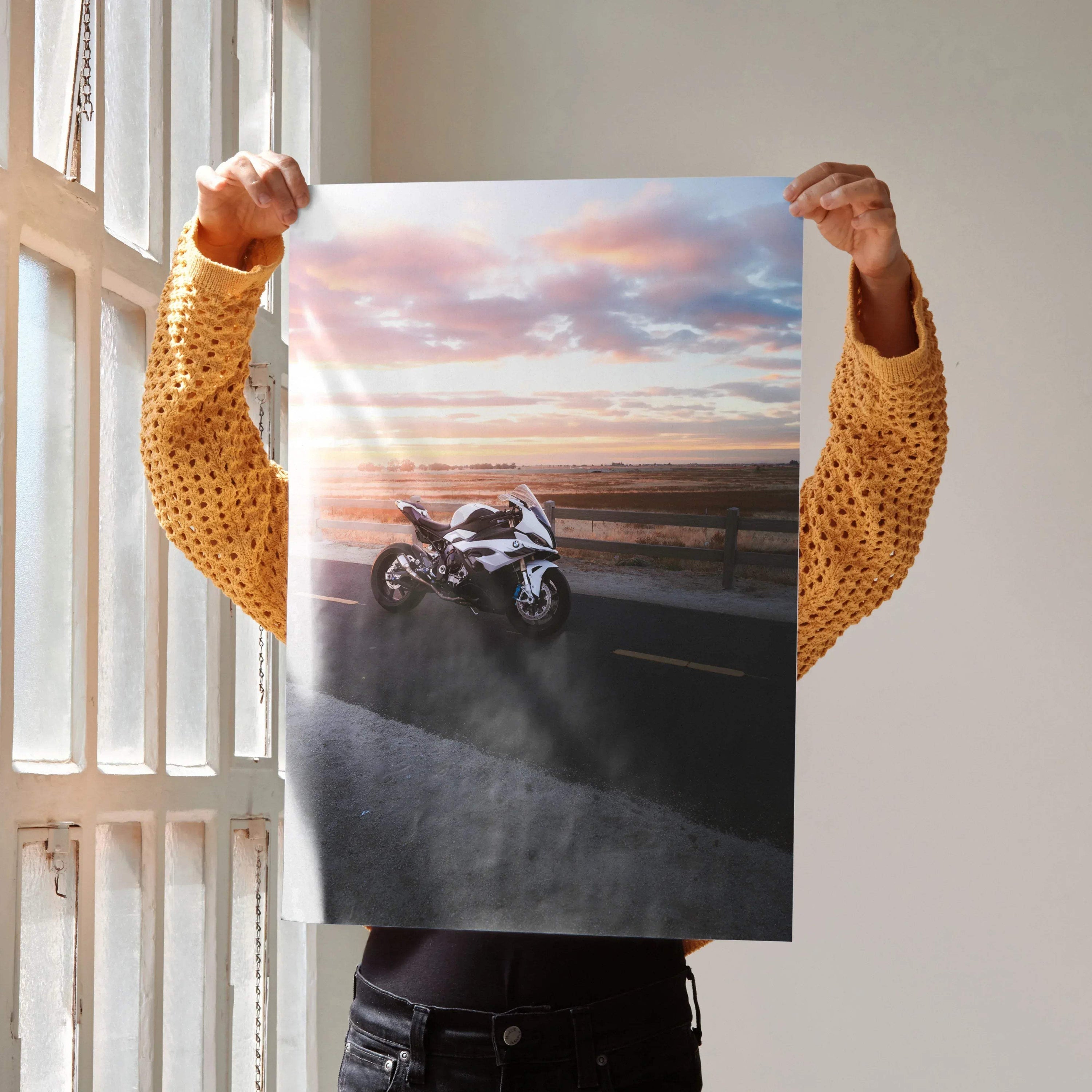BMW S1000RR motorcycle on road at sunset poster wall art with dramatic sky colors.