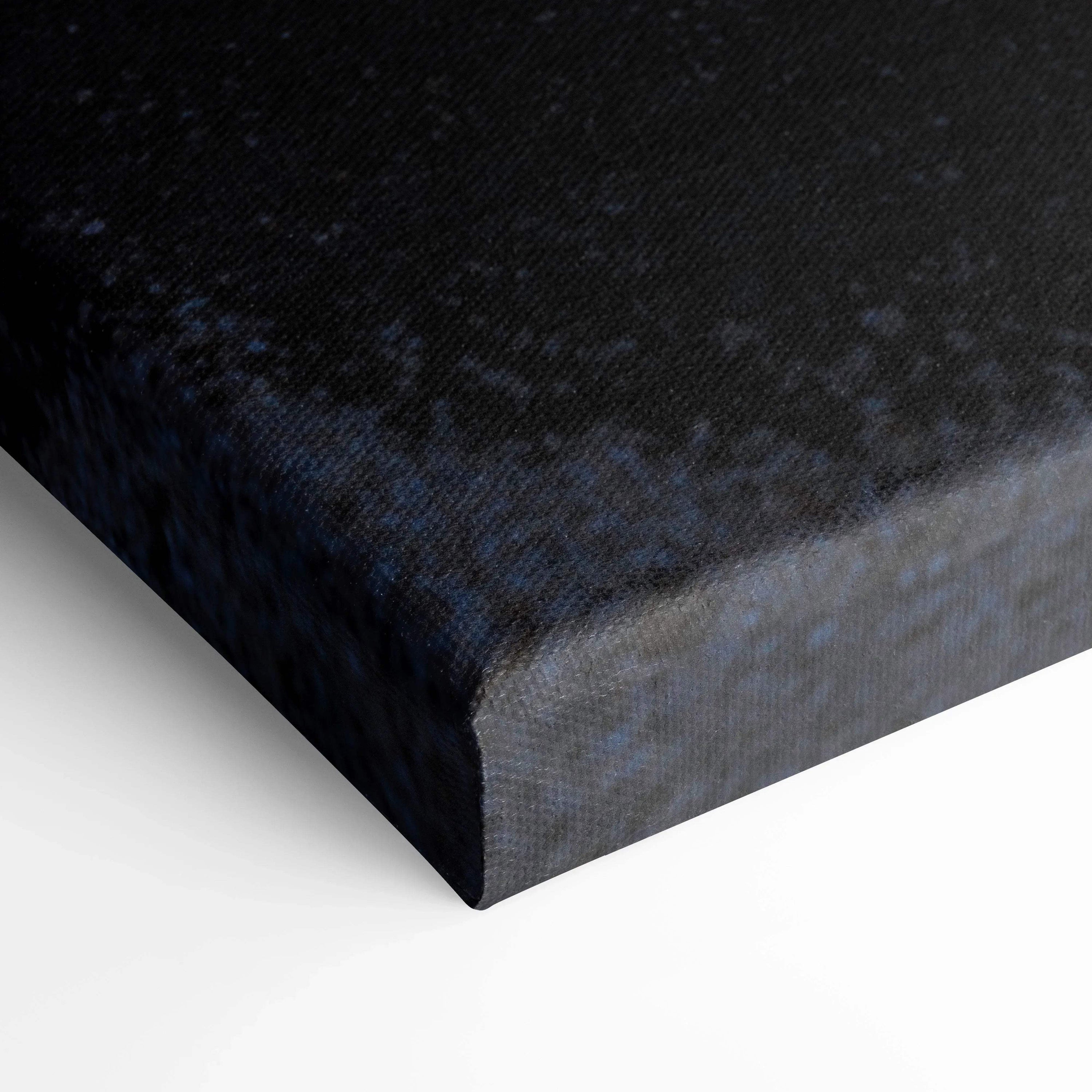 Close-up of black textured canvas corner with museum-quality wrap for wall art.