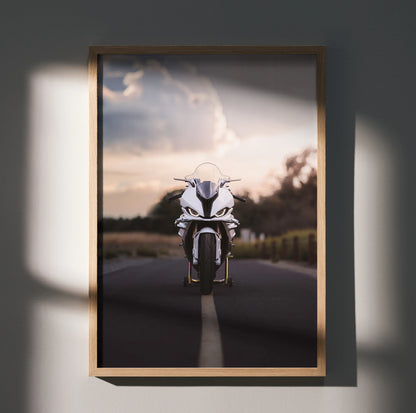 BMW S1000RR motorcycle poster with sunset backdrop, sleek design wall art in wooden frame.