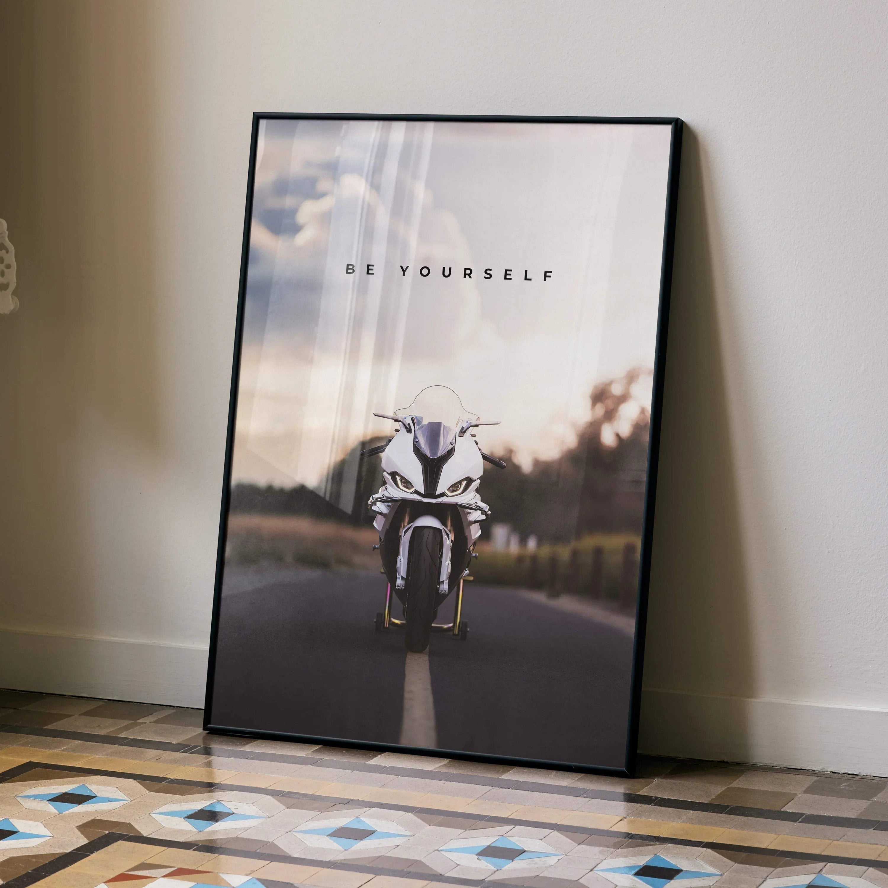 Motivational poster wall art featuring BMW S1000RR motorcycle on open road with "Be Yourself" text.