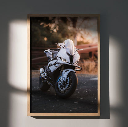 BMW S1000RR motorcycle poster featuring sleek white bike in moody outdoor setting wall art.
