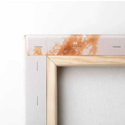 Close-up of stretched canvas corner with wooden frame and orange paint detail, wall art canvas print.