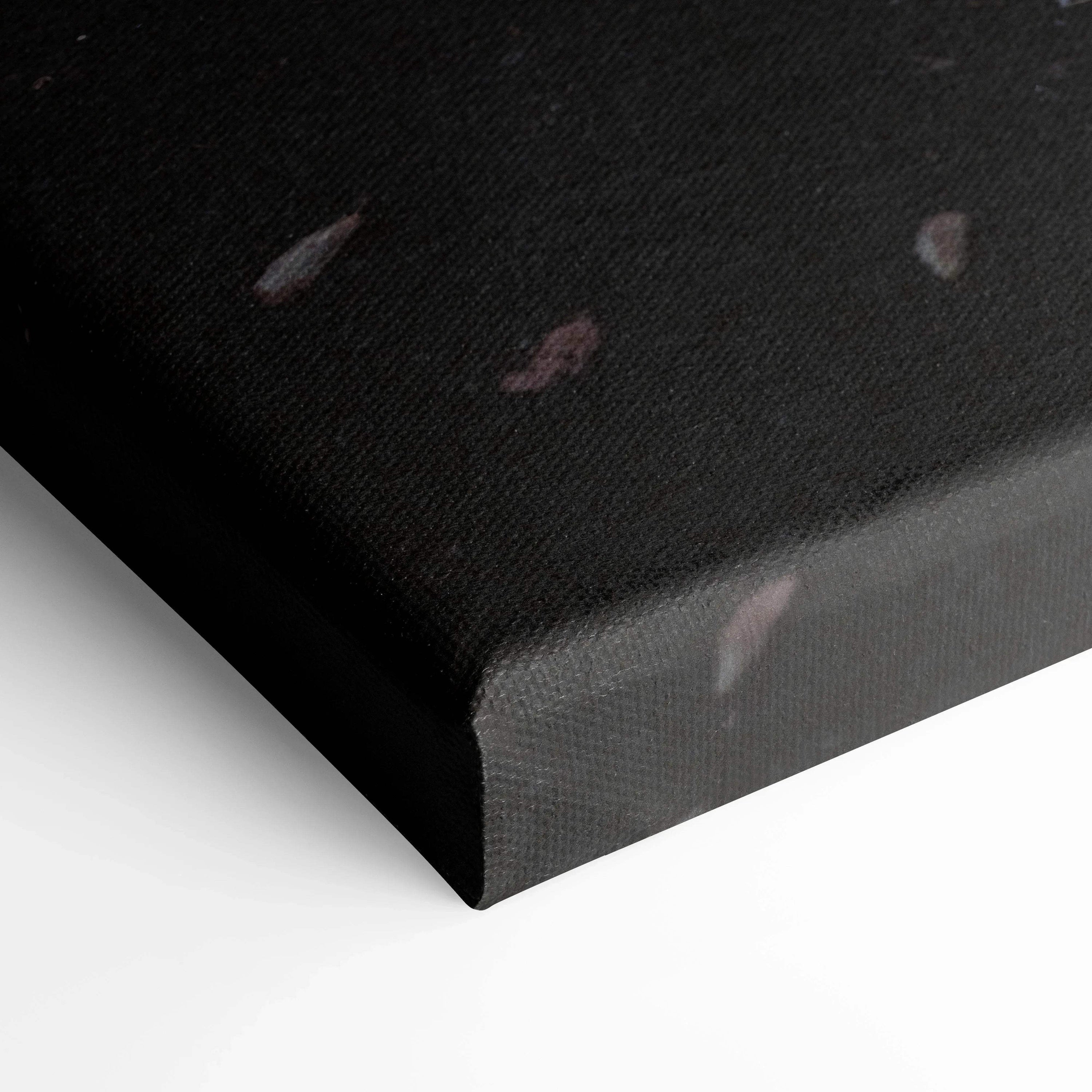 Close-up of black canvas wall art corner featuring subtle sunset tones and BMW S1000RR design elements.