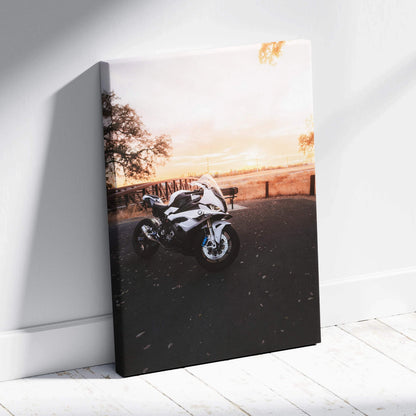 BMW S1000RR motorcycle at sunset on vertical canvas wall art with warm sky tones.