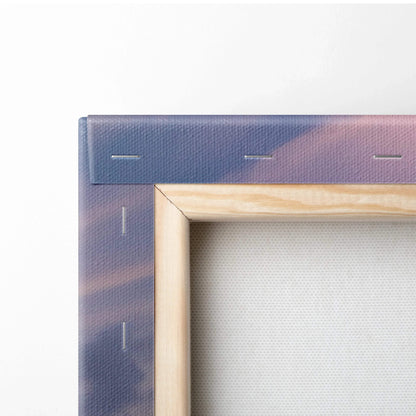 Close-up of wooden frame and stapled edge on BMW S1000RR themed canvas wall art with subtle sunset colors.