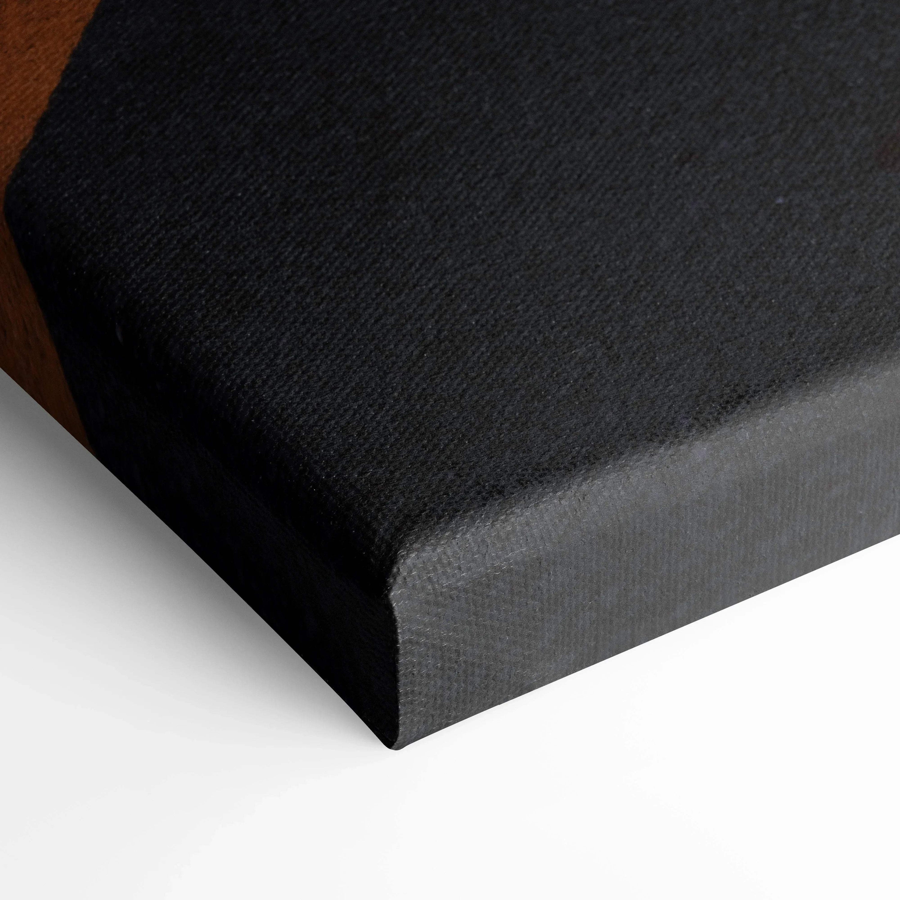 Close-up of black textured canvas edge for vertical wall art with museum-quality finish.
