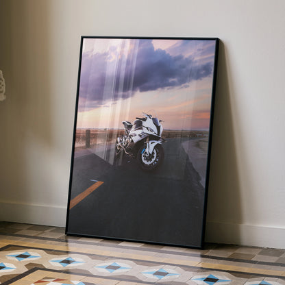 BMW S1000RR motorcycle poster with sunset background leaning against wall, modern wall art.