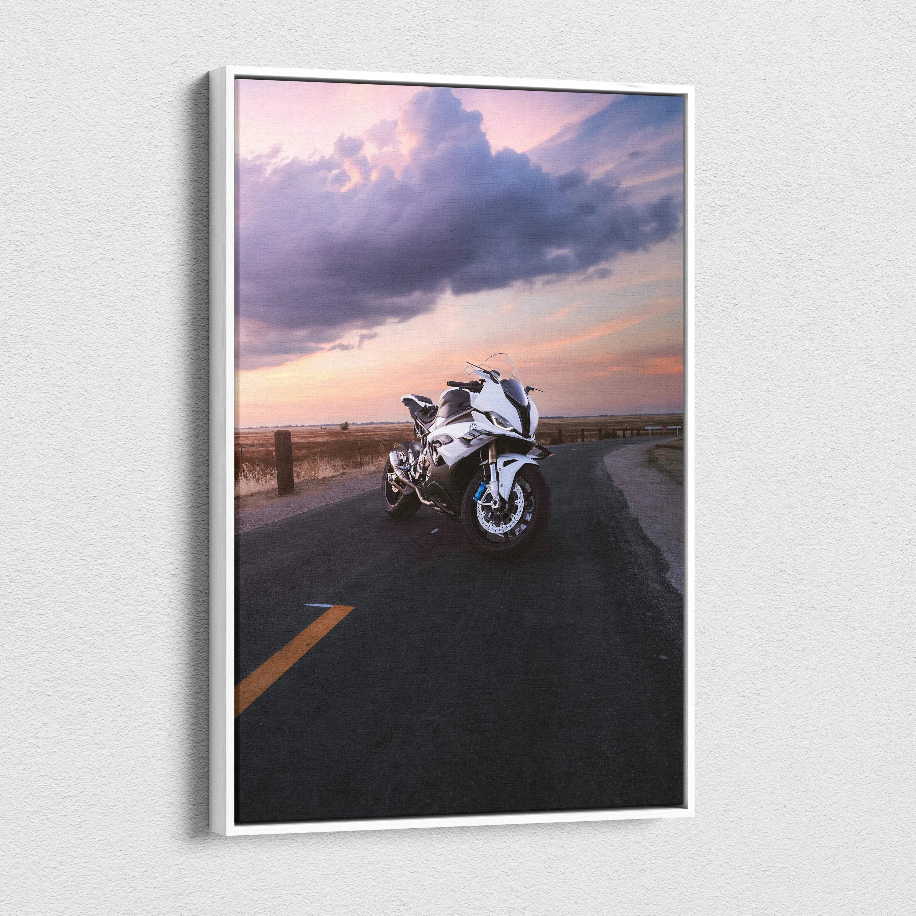 Vertical canvas wall art featuring a white BMW S1000RR motorcycle on a sunset road background.